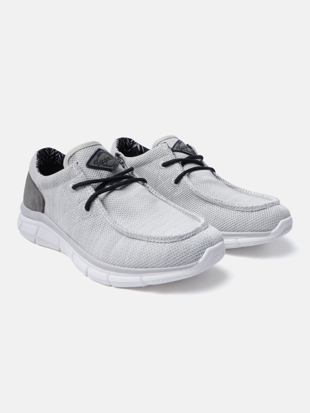 Light grey mid-top sneakers by bugatti with dark laces, patterned lining, and comfortable white soles.