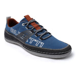 Blue comfort low-top sneakers by Bugatti, featuring grey laces, brown detailing, and decorative stitching.
