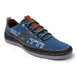 Blue comfort low-top sneakers by Bugatti, featuring grey laces, brown detailing, and decorative stitching.