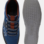 Blue low-top sneakers by bugatti, featuring grey laces, and a textured, patterned sole.
