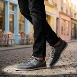 Lifestyle shot of bugatti Bimini grey low top sneakers with a knit texture and black laces.
