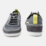 Grey knit low-top sneakers by bugatti, featuring black bungee laces, grey accents, and a white sole.