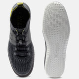 Grey comfort low-top sneakers by bugatti showing a textured upper and patterned sole.