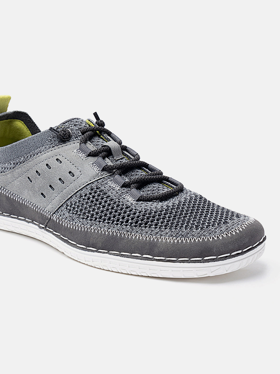 Grey comfort low top sneakers by bugatti, featuring a mesh upper and bungee lacing.
