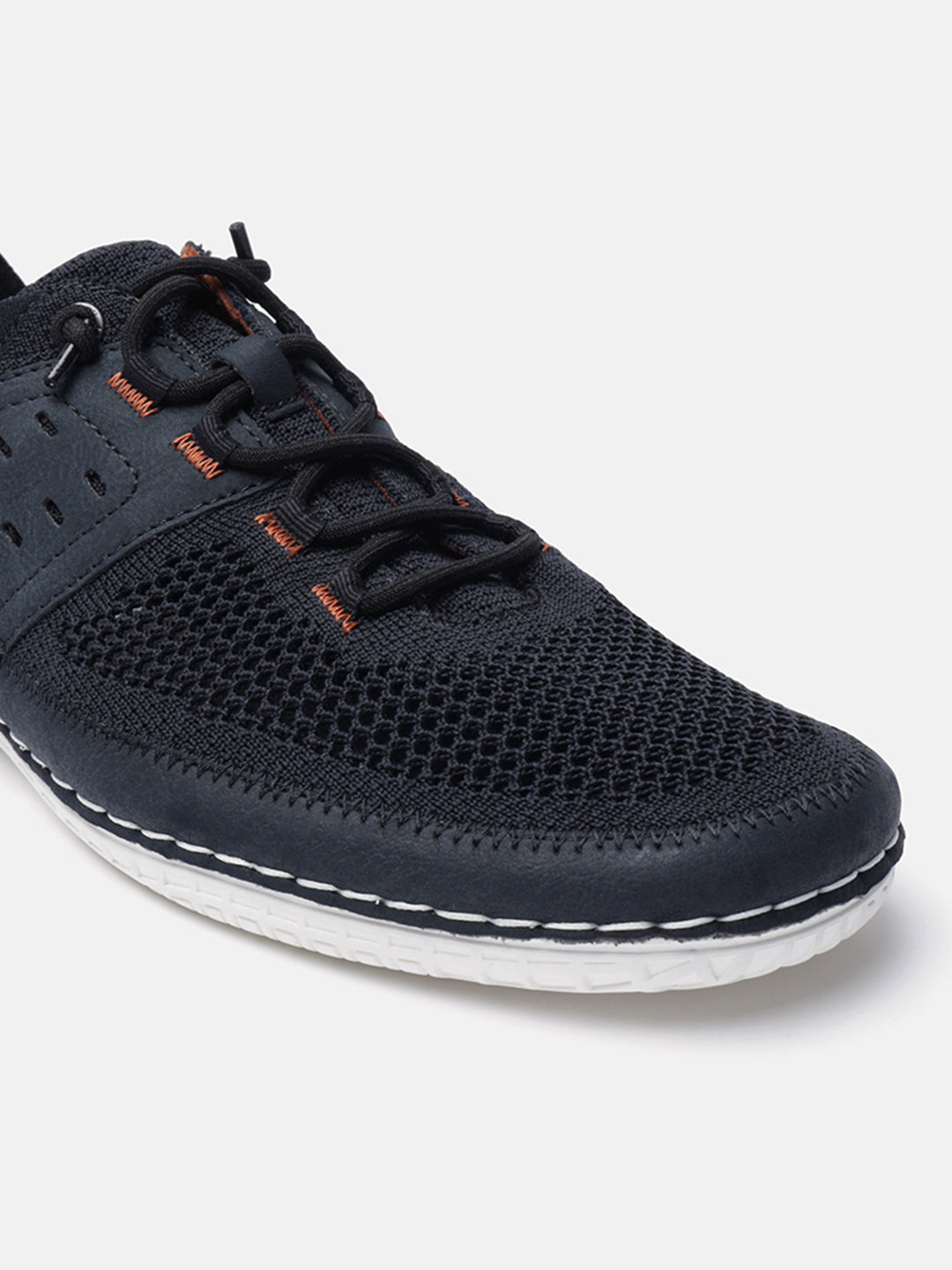 Dark blue comfort low-top sneakers by bugatti, with a breathable mesh upper and decorative white stitching.