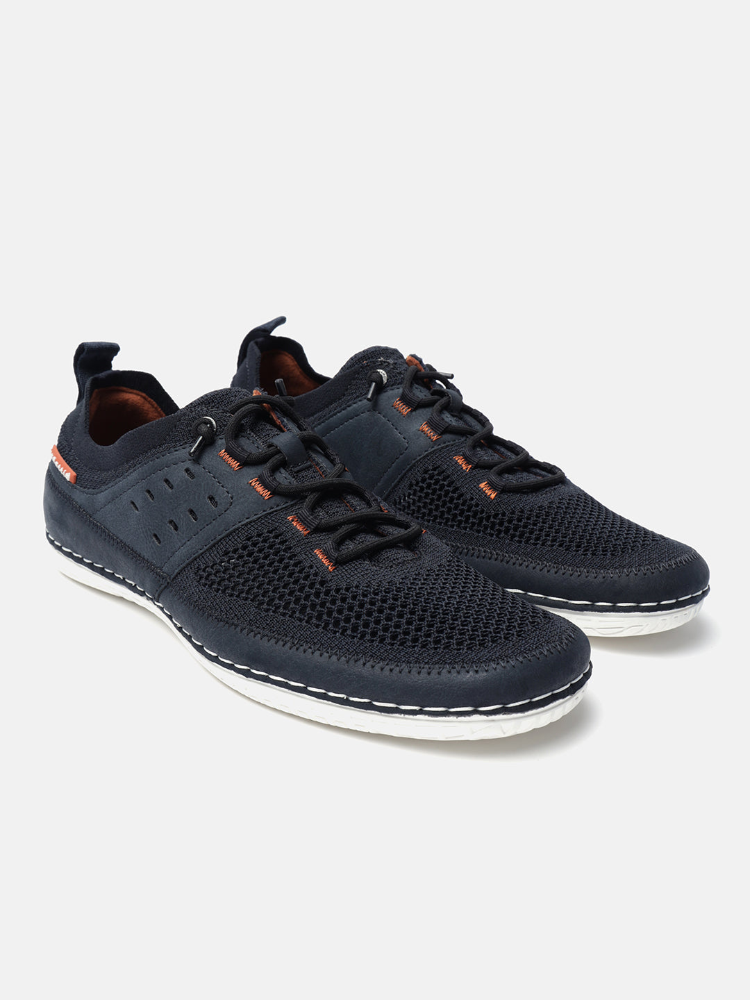Dark blue comfort low-top sneakers by bugatti featuring a mesh upper and decorative orange stitching.