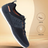 Dark blue low top sneaker by bugatti, shown in a three-quarters view, with orange accent stitching.