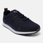 Dark blue denim sneaker by bugatti with brown accents at the heel and sole, and an emblem on the side.