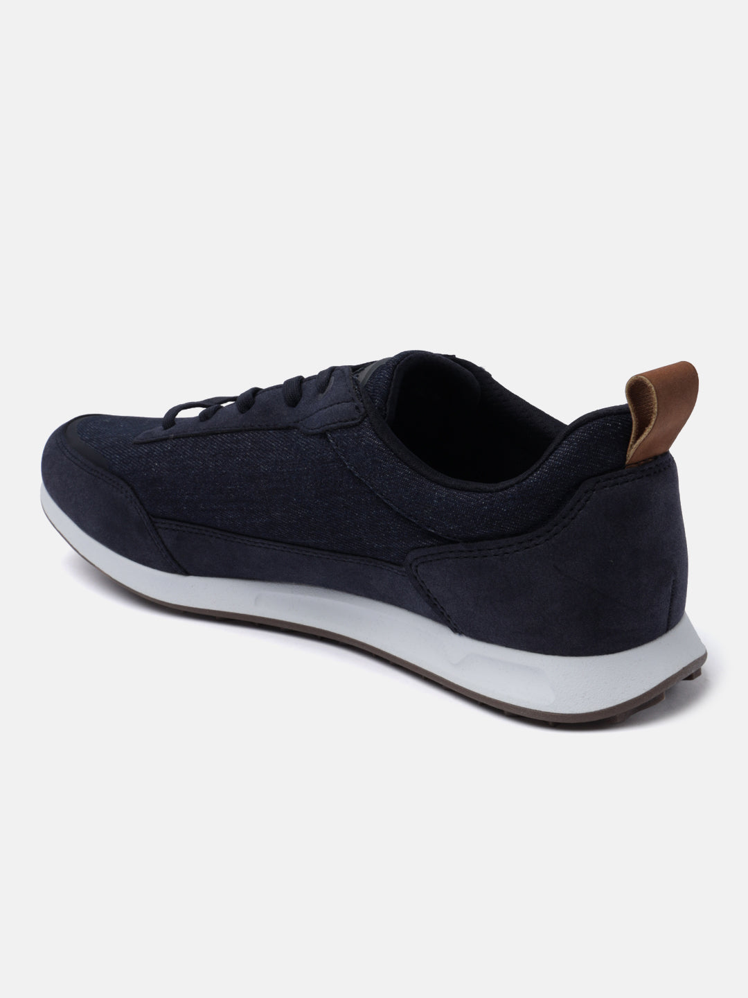 Dark blue sneakers by bugatti, with a tan heel tab and white midsole, in a side view.