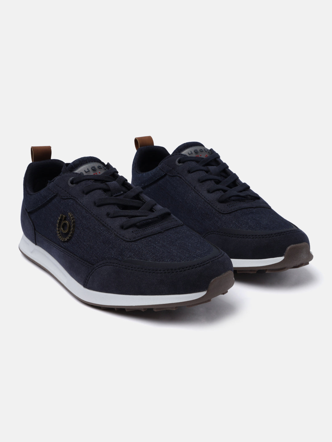 Dark blue denim sneakers by bugatti, featuring brown heel tabs, textured overlays, and white midsoles.