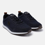 Dark blue denim sneakers by bugatti, featuring brown heel tabs, textured overlays, and white midsoles.