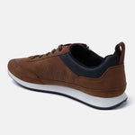 Cognac comfort sneaker by bugatti with navy detailing around the ankle and a white rubber sole.