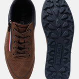 Cognac comfort mid-top sneakers by bugatti, showing the perforated upper and patterned blue outsole.