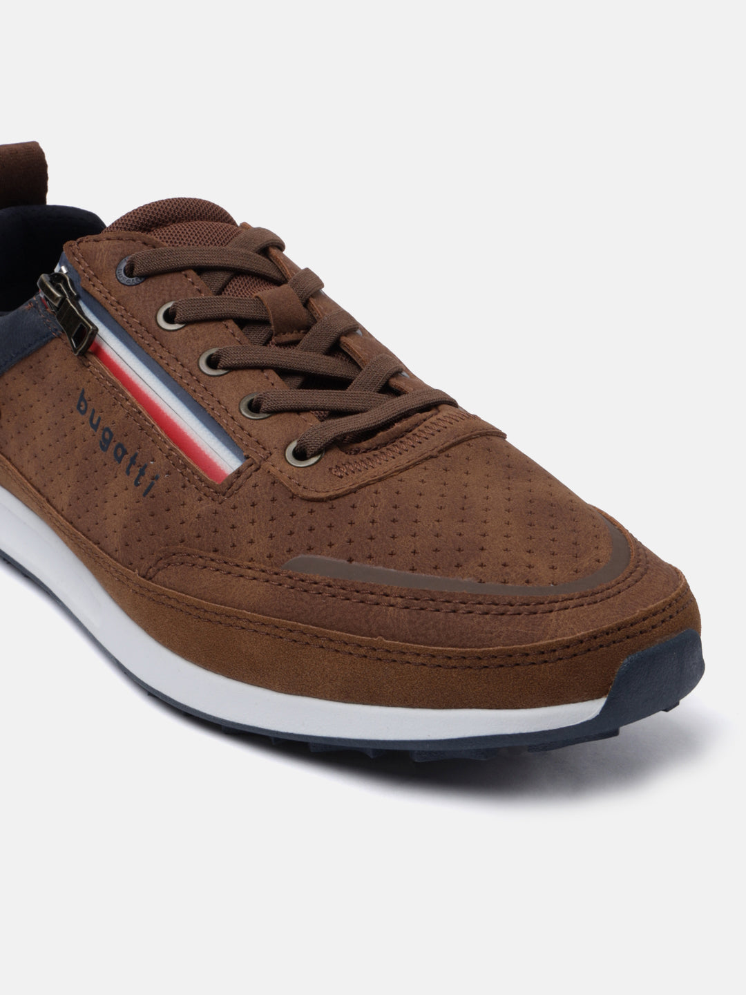 Brown casual sneaker by bugatti with a red, white, and blue stripe, brown laces, and perforated leather texture.