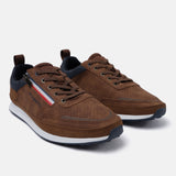 Cognac sneakers by Bugatti with lace-up closure, side zipper detail, and contrast soles.