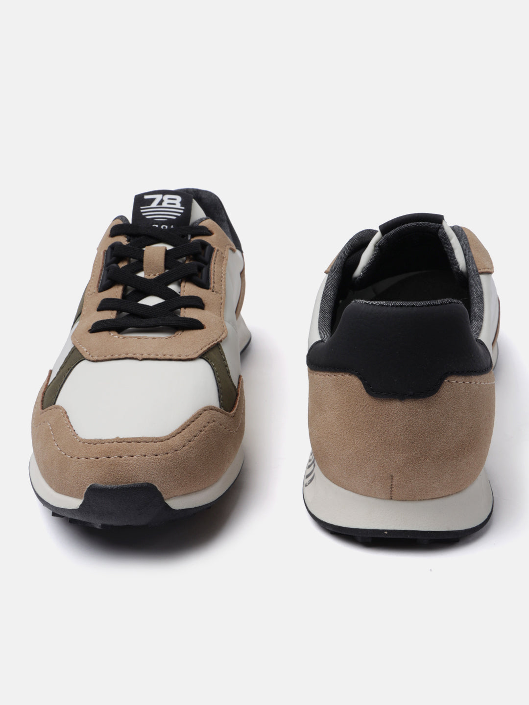 Beige casual sneakers by bugatti with black accents and suede texture.