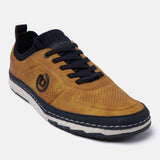 Yellow comfort low top sneakers by bugatti, featuring a dark blue knitted ankle collar and dark blue laces.