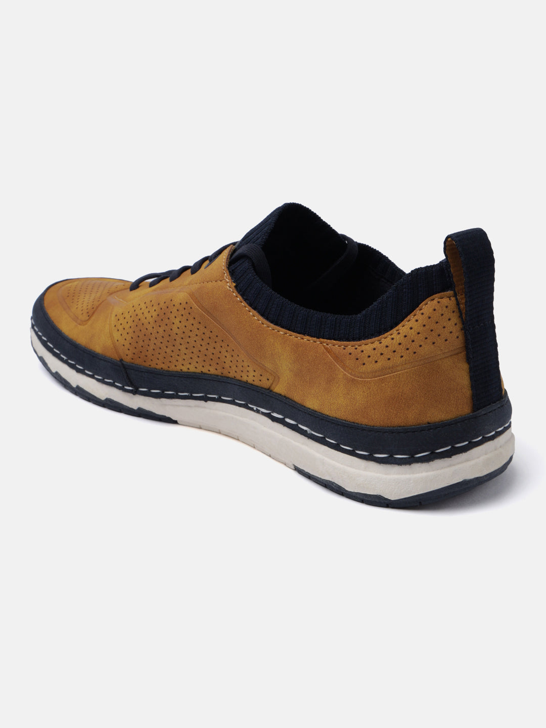 Yellow comfort low top sneakers by bugatti with perforated detail and contrasting sole.