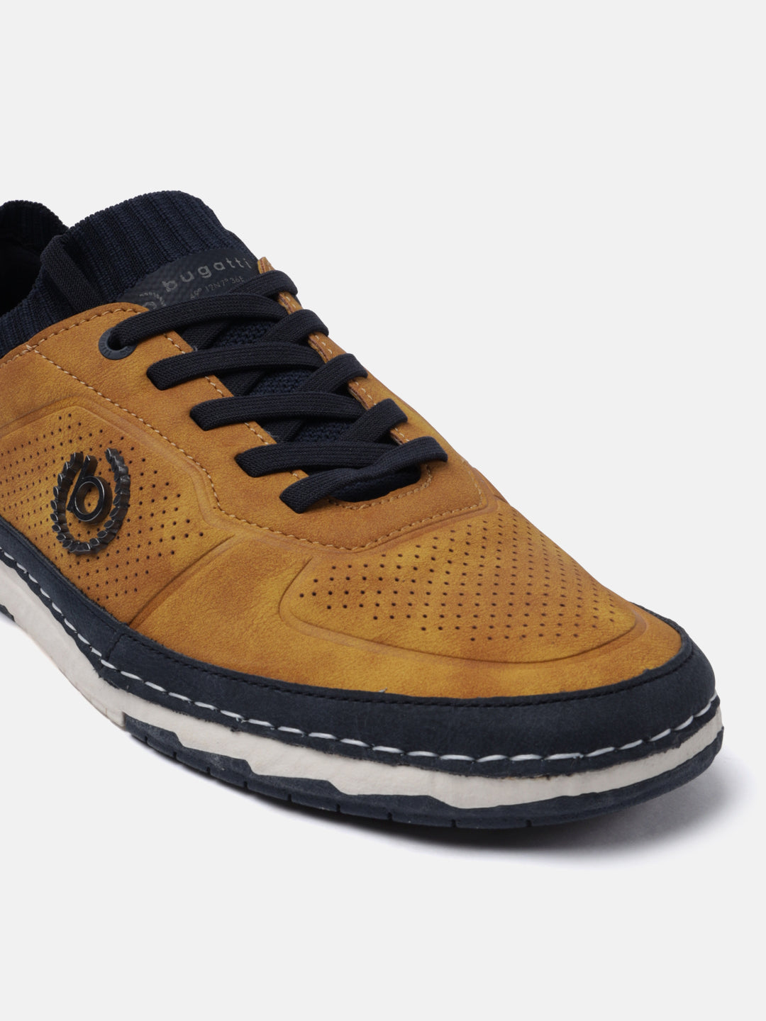 Yellow low top sneaker by bugatti with a perforated toe, navy blue accents, and black laces.
