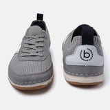 Grey low-top sneakers by Bugatti, showcasing a knit texture, lace-up design, and logo detail on the heel.