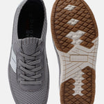 Grey low top sneakers by bugatti with laces, showing upper and sole patterns.