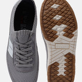 Grey low top sneakers by bugatti with laces, showing upper and sole patterns.