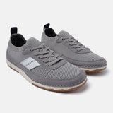 Gray knit low top sneakers by bugatti with suede trim and brown rubber outsoles.
