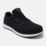 Black mid top sneakers by bugatti with mesh texture and brown accent on the heel.