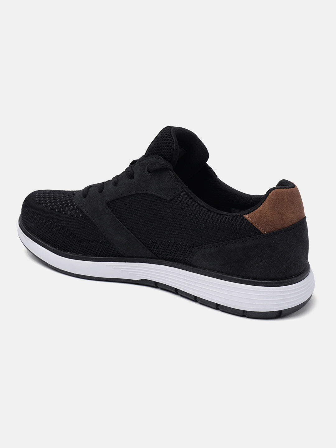 Black comfort sneakers by bugatti with brown accent at the heel.