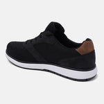Black comfort sneakers by bugatti with brown accent at the heel.