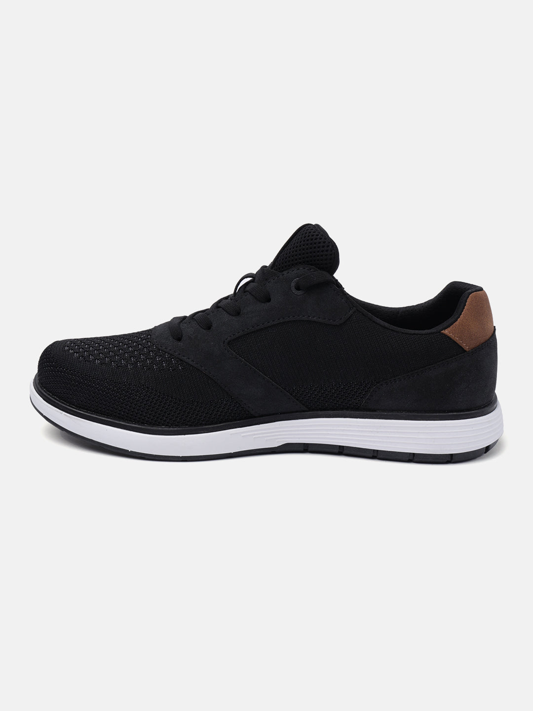 Black comfort sneaker by bugatti with a mesh and suede upper, and a brown heel accent, in a side view.
