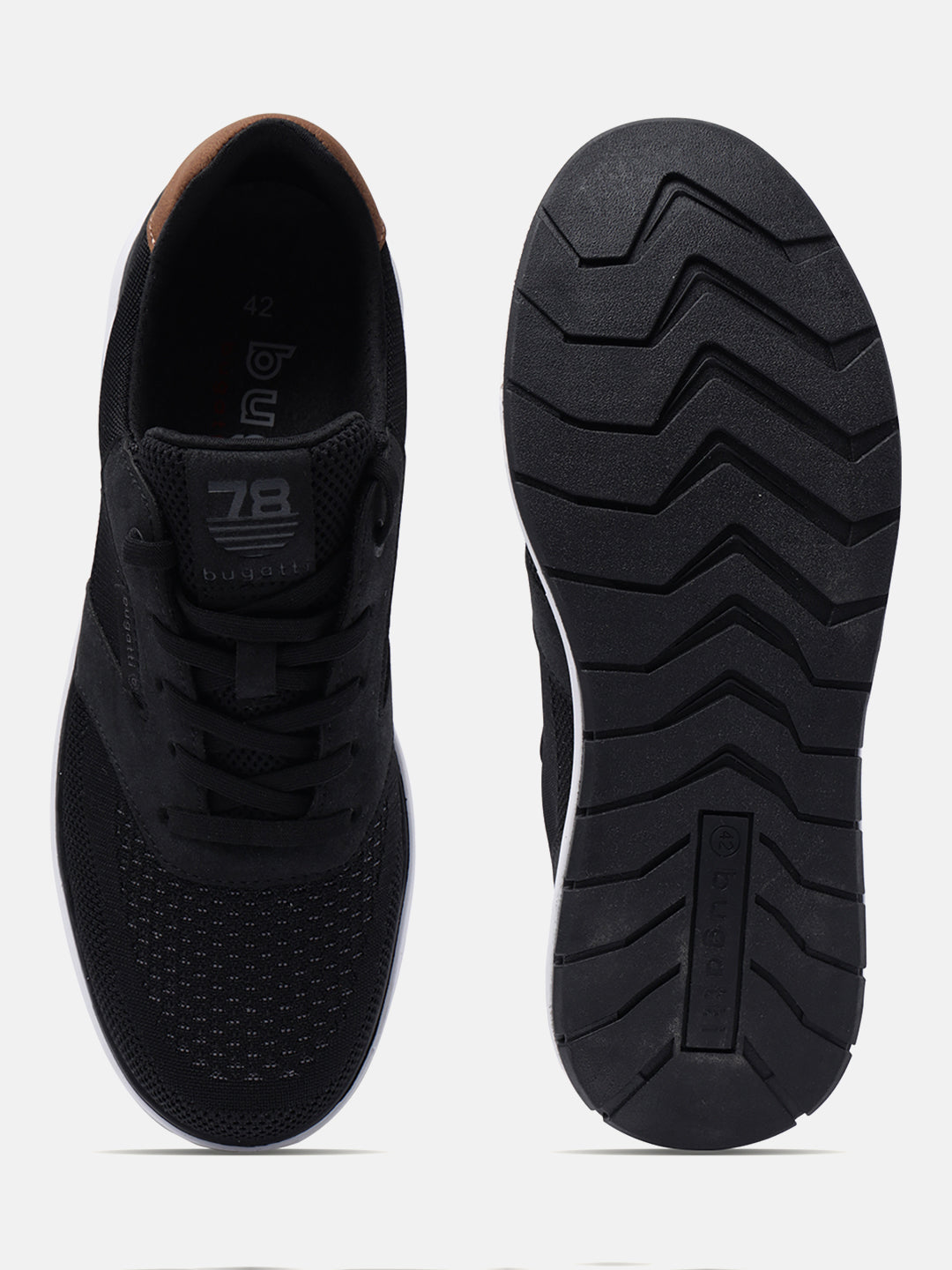 Black comfort sneakers by bugatti with brown heel counter and patterned black sole.