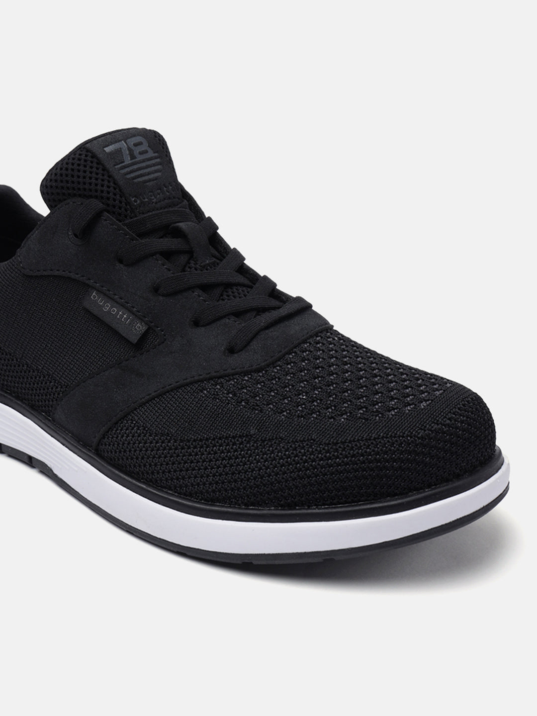 Black comfort sneakers by bugatti, featuring a textile upper with tonal stitching and white midsole.