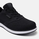 Black comfort sneakers by bugatti, featuring a textile upper with tonal stitching and white midsole.