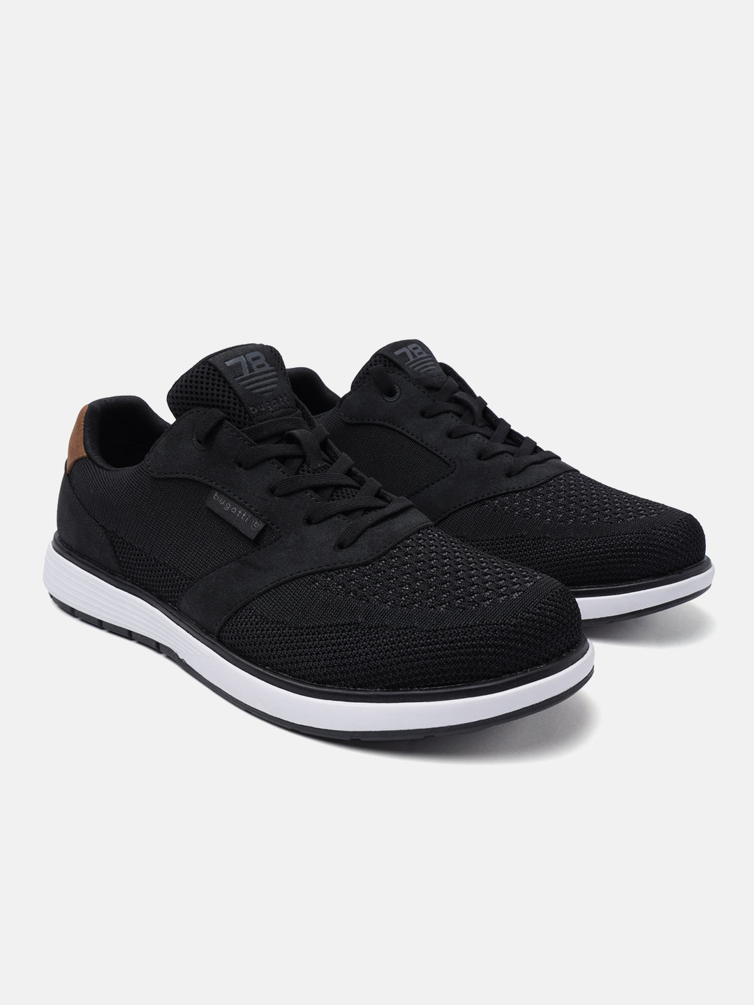 Black mid-top sneakers by bugatti with white midsoles and brown accent on heel.