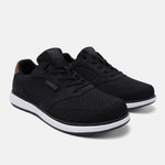 Black mid-top sneakers by bugatti with white midsoles and brown accent on heel.
