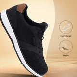 Black comfort sneaker by bugatti with a white sole and a brown heel accent.