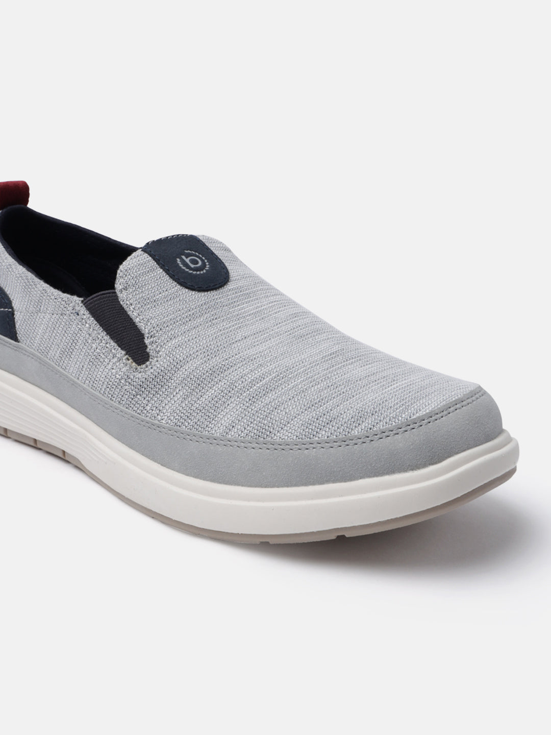A grey Men's bugatti Casual Loafers featuring a round plain toe, zero heels heel. Made from synthetic with a durable eva outsole, this slip-on design offers both style and comfort.