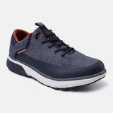 Dark blue comfort sneakers by bugatti, with blue knit upper, white sole, and tan colored lining.
