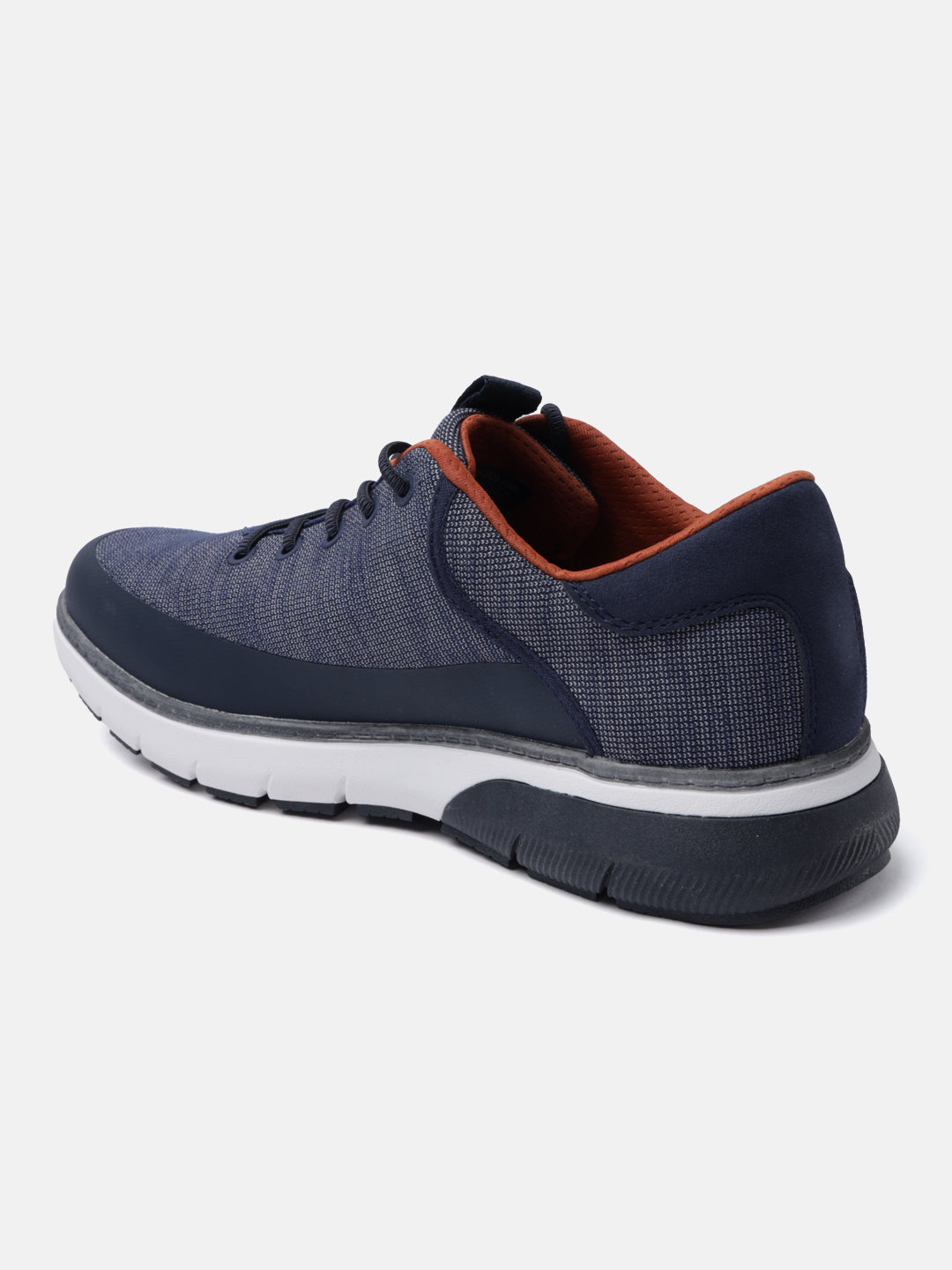 Dark blue comfort mid top sneakers by bugatti with a textured upper and brown trim.