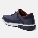 Dark blue comfort mid top sneakers by bugatti with a textured upper and brown trim.