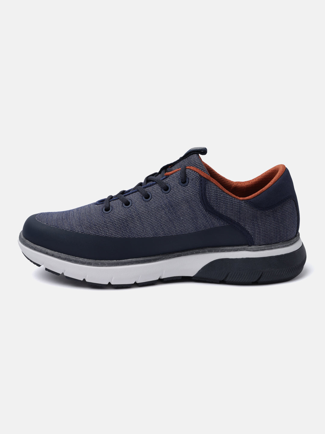 Dark blue comfort sneaker by bugatti with an orange interior, contrasted with a white and dark grey sole.