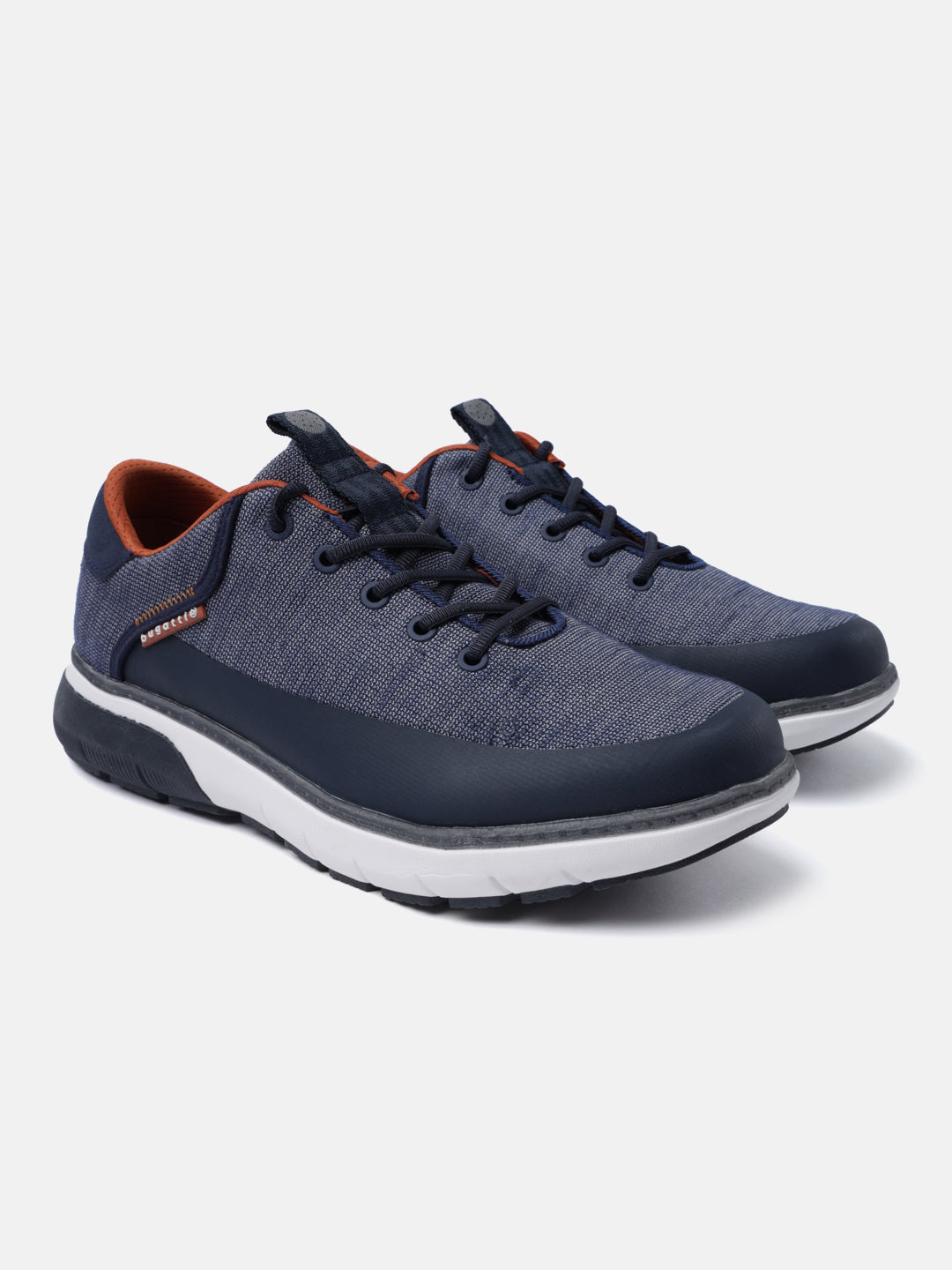 Dark blue comfort sneakers by bugatti with a textured finish and orange inner lining.