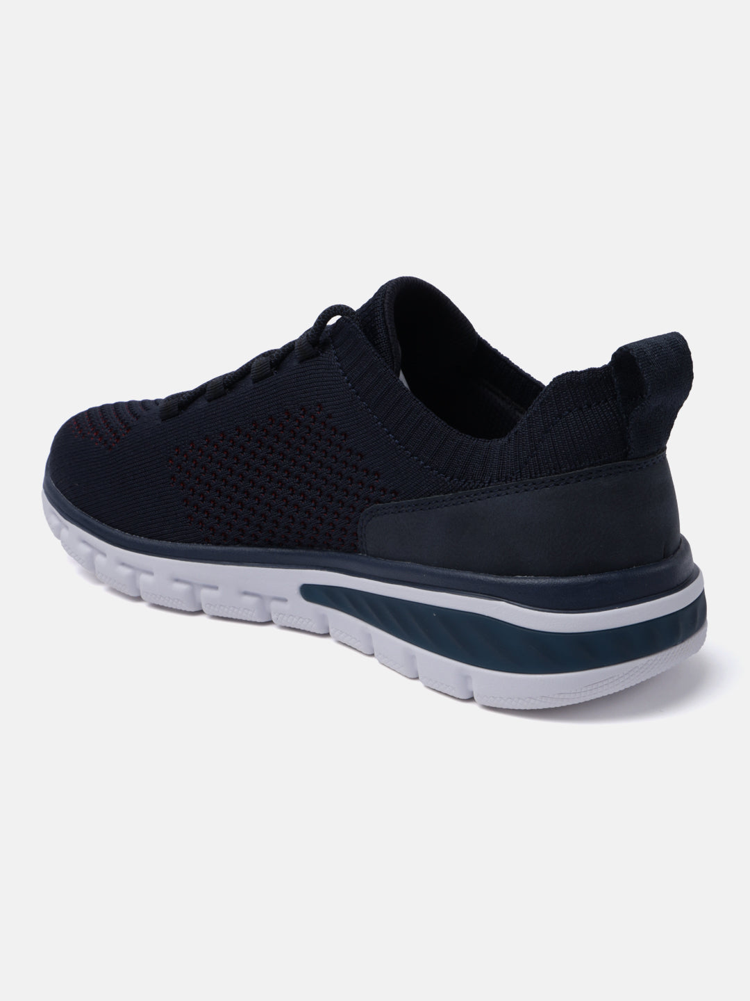 Dark blue comfort sneakers by bugatti with a textured knit upper and a contrasting white sole.
