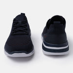 Dark blue comfort sneakers by bugatti, featuring knit uppers with lace-up closure and a white sole.