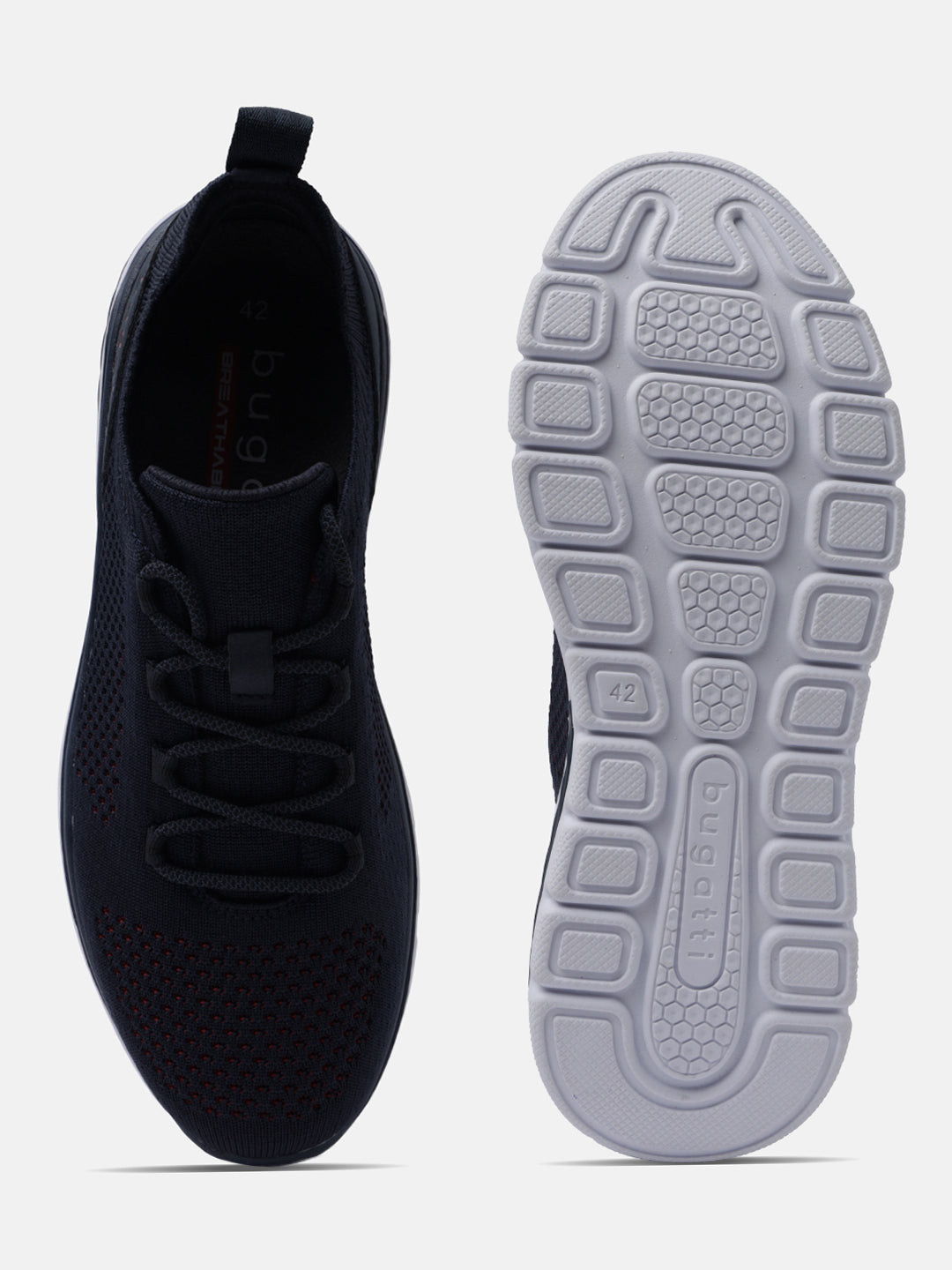Dark blue comfort sneakers by bugatti, featuring breathable knit texture and patterned white sole.