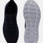 Dark blue comfort sneakers by bugatti, featuring breathable knit texture and patterned white sole.
