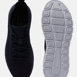 Dark blue comfort sneakers by bugatti, featuring breathable knit texture and patterned white sole.
