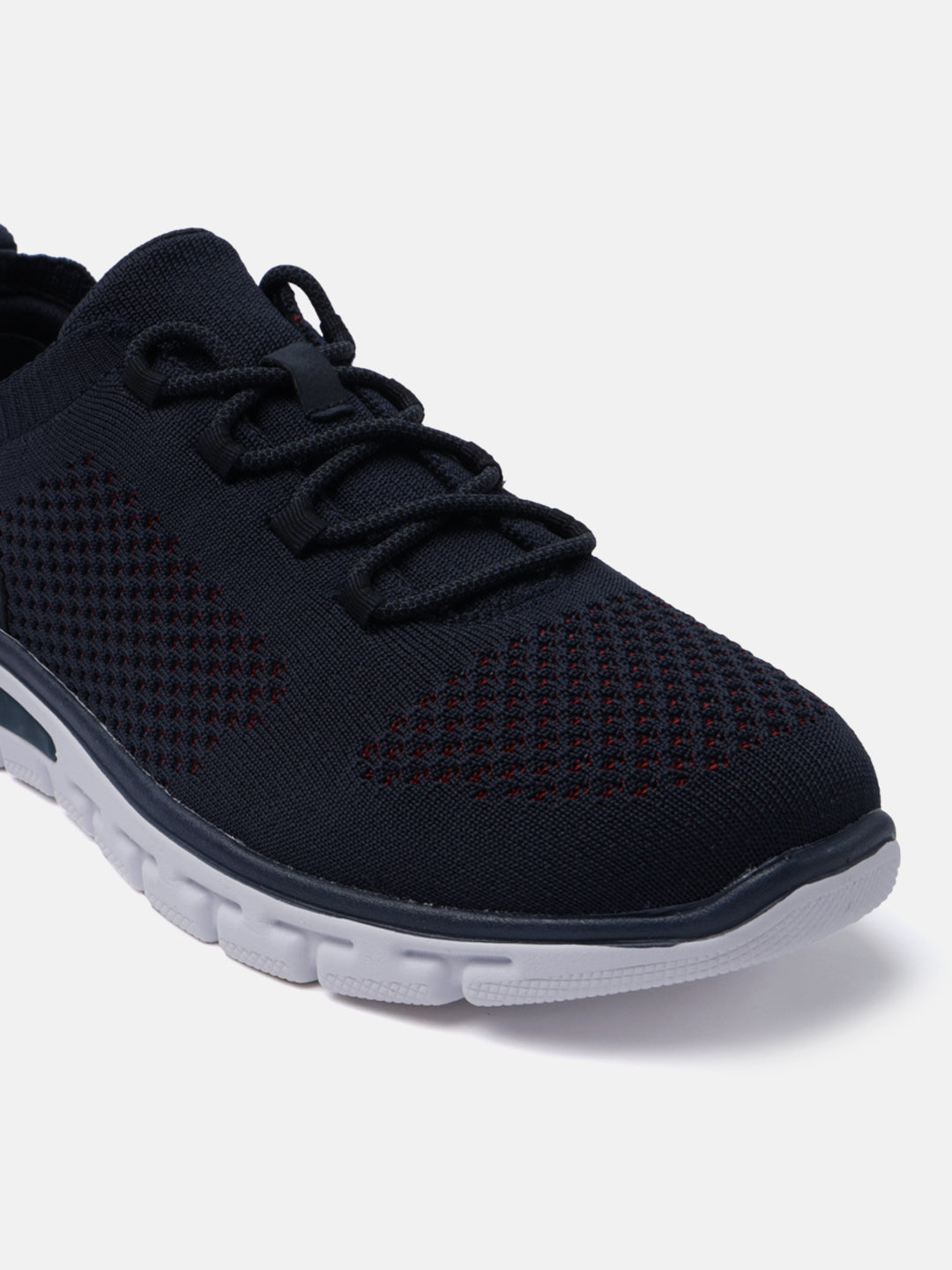 Dark blue comfort sneakers by bugatti with knit texture, matching laces, and a white sole.