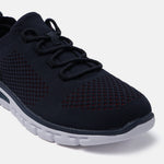 Dark blue comfort sneakers by bugatti with knit texture, matching laces, and a white sole.